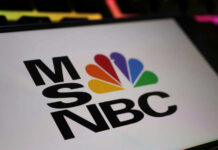 MSNBC logo with colorful peacock emblem.