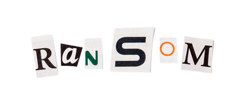 Cut-out letters spelling 'Ransom' arranged in a collage style