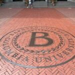 Emblem of Barnard College embedded in brick pavement at Columbia University
