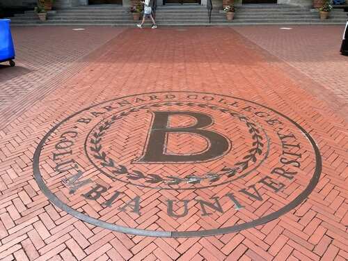 shutterstock_2336211491 (1).jpg Emblem of Barnard College embedded in brick pavement at Columbia University