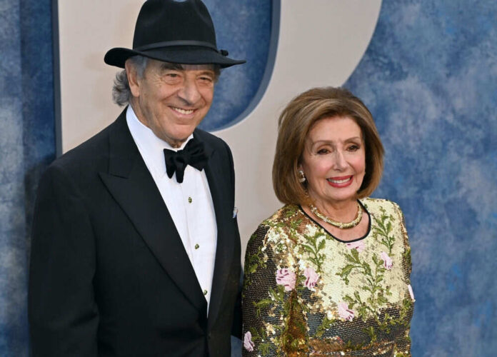 Man in tuxedo and woman in sequined floral dress.