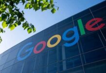 Google logo displayed on a glass building with greenery in the foreground