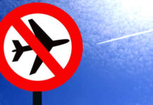 A no-fly zone sign against a blue sky