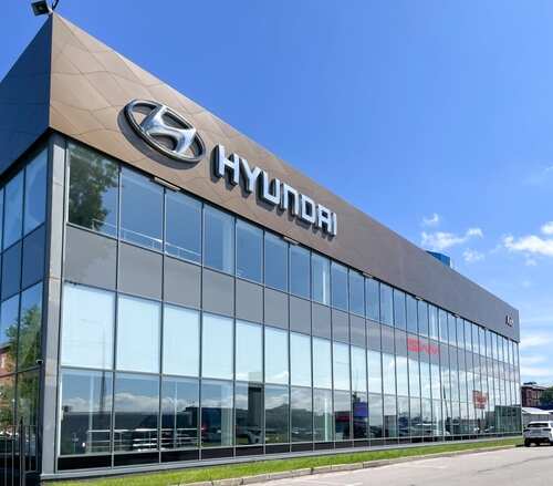 shutterstock_2493117135.jpg Exterior view of a Hyundai car dealership with large glass windows