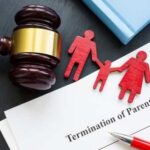 Gavel and family figures next to a legal document about parental rights