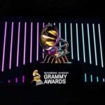 Grammy Winner’s Mysterious Final Words… Grammy trophy displayed with colorful background