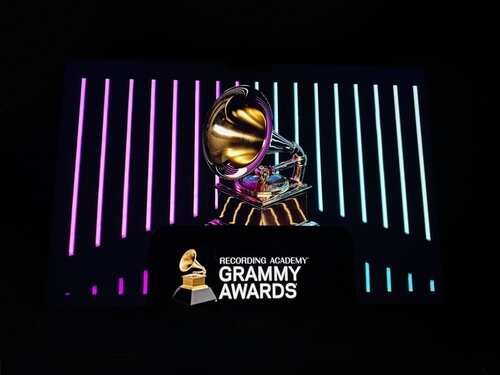 shutterstock_2573334695.jpg Grammy trophy displayed with colorful background