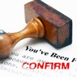 Rubber stamp on a termination notice with the words 'You've Been Fired' and 'CONFIRM'