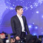 Speaker on stage at a technology conference