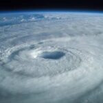 Satellite view of a swirling hurricane with a clear eye