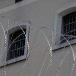 Barbed wire in front of prison windows