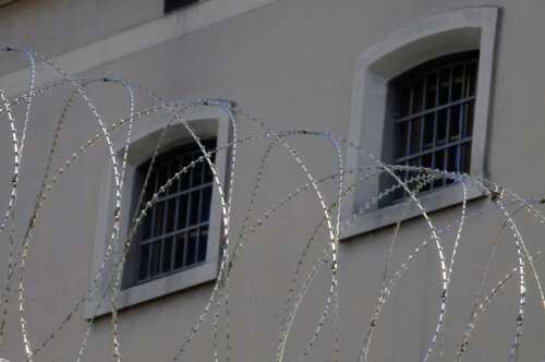 Barbed wire in front of prison windows