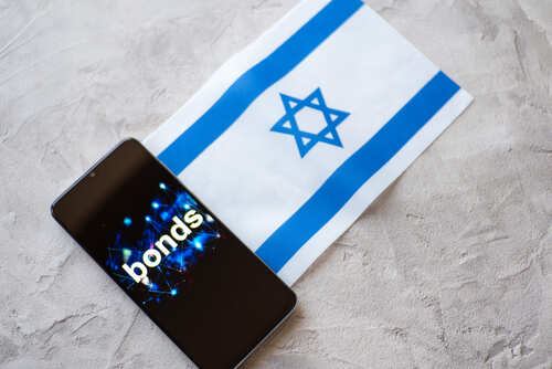 A smartphone displaying the word 'bonds' next to the Israeli flag