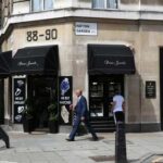 A man walking past a jewelry shop on Hatton Garden