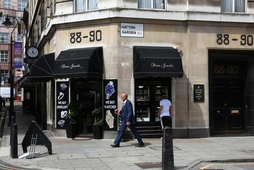 A man walking past a jewelry shop on Hatton Garden