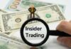 A magnifying glass focusing on the words 'Insider Trading' with a figure standing on dollar bills