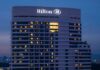 Hilton hotel building illuminated at night