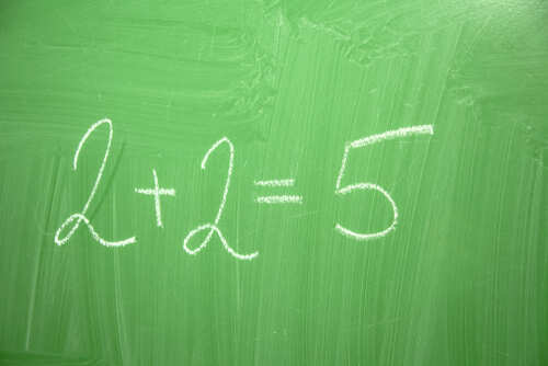 shutterstock_1279478392.jpg Chalkboard with the incorrect equation 2+2=5 written in white chalk
