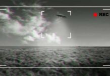 Obama Confirms Weird Sky Footage A UFO hovering above a field with a cloudy sky in the background