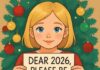 A child holding a sign that says 'DEAR 2026, PLEASE BE NICE.' in front of a decorated Christmas tree