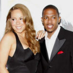 Mariah Carey and Nick Cannon posing together at a red carpet event