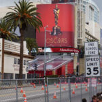 Billboard advertising the Oscars with a golden statue in Hollywood