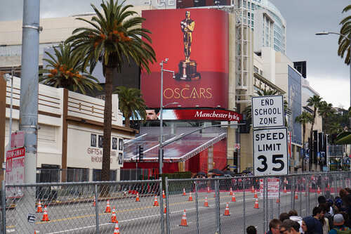 Billboard advertising the Oscars with a golden statue in Hollywood