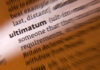 Close-up of a dictionary page highlighting the word 'ultimatum'
