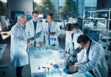 Group of scientists in a laboratory working together on experiments