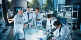 Group of scientists in a laboratory working together on experiments