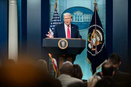 shutterstock_2747468545.jpg A speaker at a podium during a press conference at the White House