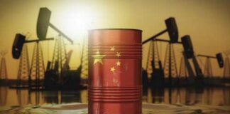 An oil barrel featuring the Chinese flag against a sunset backdrop with oil rigs