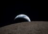 View of Earth rising above the lunar surface