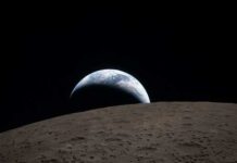 View of Earth rising above the lunar surface