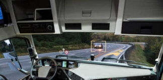 Interior view of a truck with a focus on the dashboard and road ahead