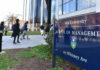 People walking outside Yale School of Management building