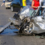 Giuliani’s High-Speed Crash: What Really Happened? Severely damaged car after a collision on the road