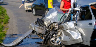 Severely damaged car after a collision on the road
