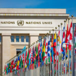 Rogue City Hall Courts Iran — DC Slams Brakes United Nations building with numerous flags displayed