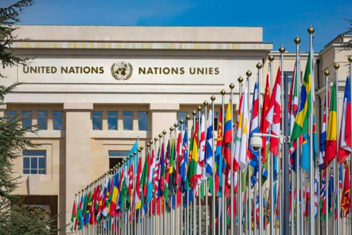 United Nations building with numerous flags displayed