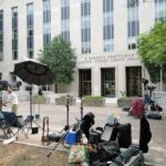 Federal Plaza Firebomb Media equipment and journalists outside a courthouse