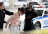 Police officers arresting a suspect in an urban environment