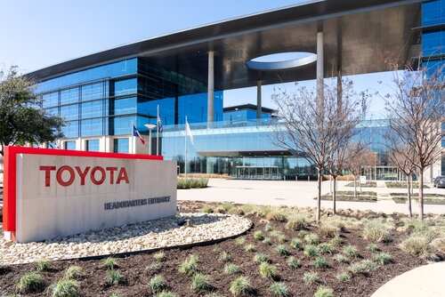 Exterior view of Toyota headquarters building with a prominent sign